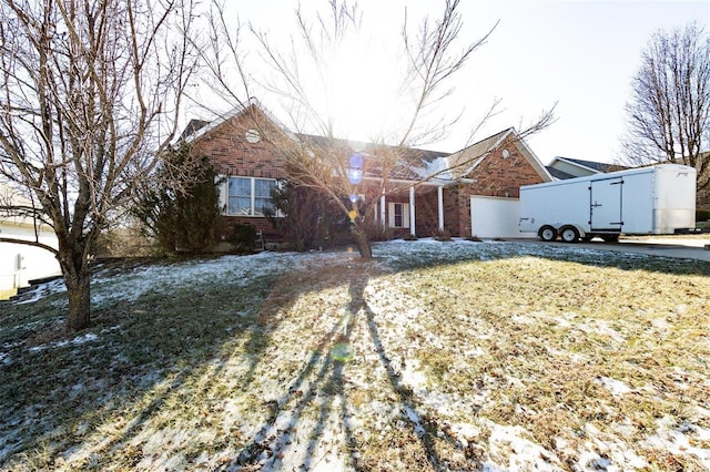 view of front of property with a garage and a front yard