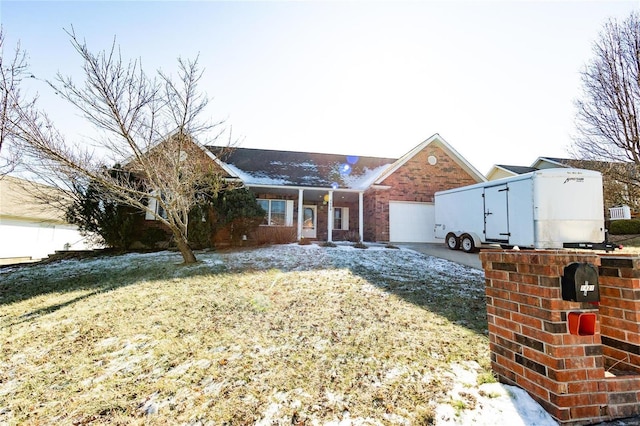 view of front of house featuring a garage and a front lawn