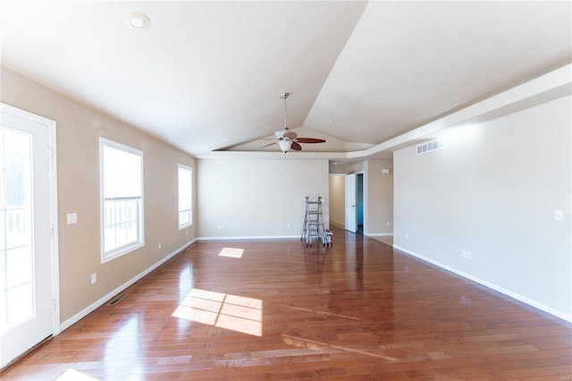 empty room featuring wood-type flooring, ceiling fan, and vaulted ceiling