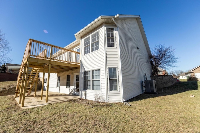 rear view of property with central AC unit, a yard, a patio area, and a deck