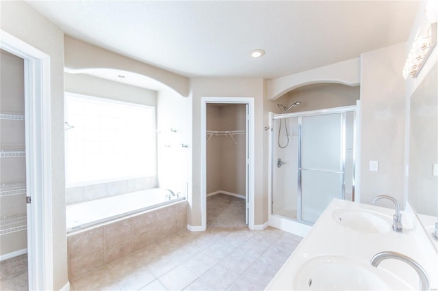 bathroom featuring vanity and shower with separate bathtub