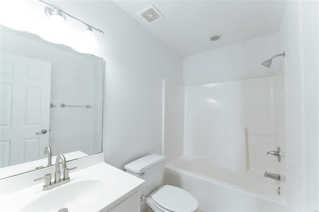 full bathroom with shower / tub combination, vanity, and toilet