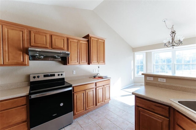 kitchen featuring vaulted ceiling, decorative light fixtures, light tile patterned floors, electric range, and an inviting chandelier