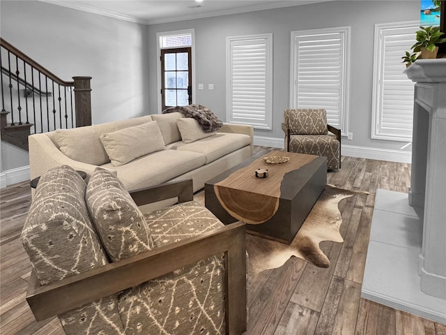 living room with crown molding and hardwood / wood-style flooring