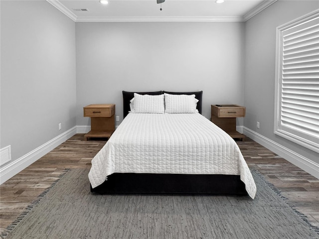 bedroom featuring dark wood-type flooring and ornamental molding