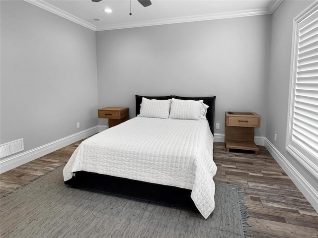 bedroom with ceiling fan, crown molding, and dark hardwood / wood-style floors