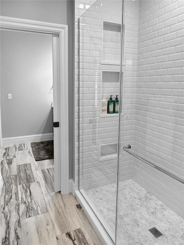 bathroom with an enclosed shower