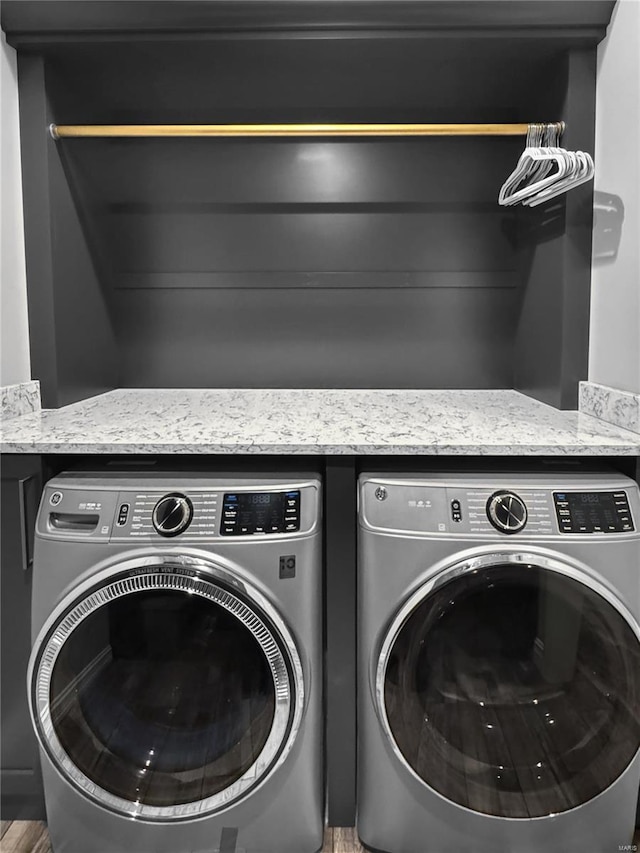 laundry room featuring separate washer and dryer