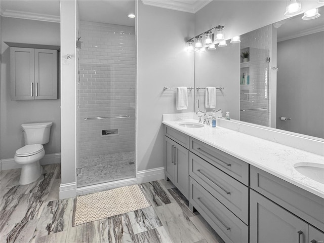 bathroom featuring vanity, crown molding, toilet, and tiled shower