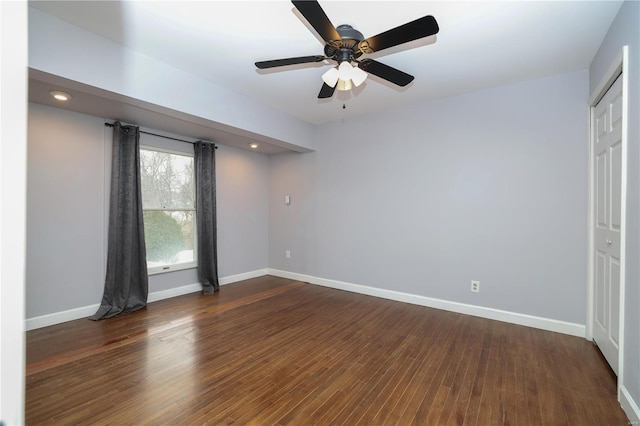 spare room with dark wood-style floors, ceiling fan, recessed lighting, and baseboards