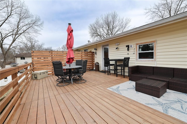 deck with outdoor dining area and an outdoor living space