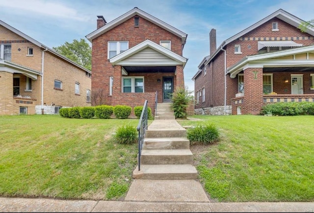 view of front of property featuring covered porch and a front yard