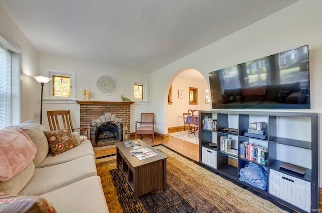 living room featuring a fireplace and hardwood / wood-style flooring