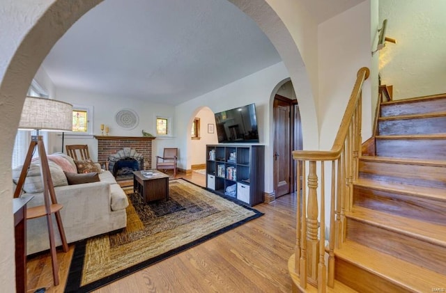 living room with light hardwood / wood-style flooring and a fireplace