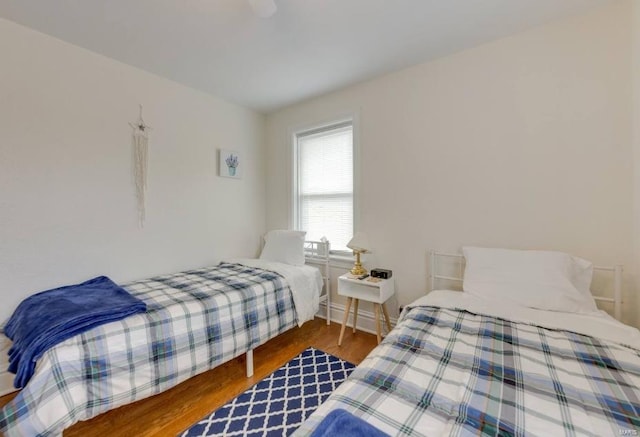 bedroom with wood-type flooring