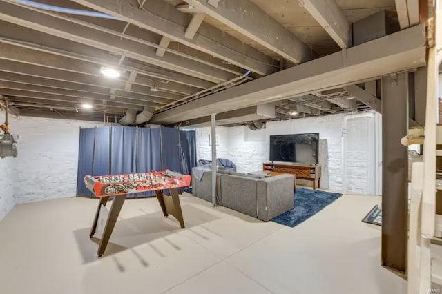 rec room featuring concrete flooring