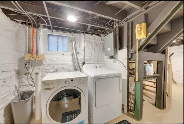 laundry area with independent washer and dryer and electric panel