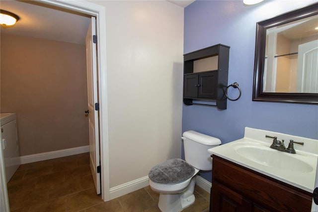 bathroom featuring toilet and vanity