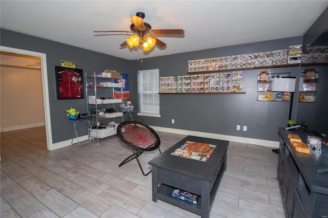 sitting room with ceiling fan