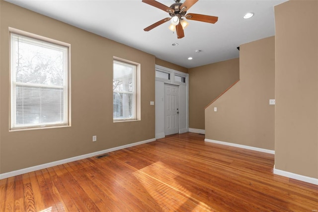 unfurnished room featuring hardwood / wood-style flooring and ceiling fan