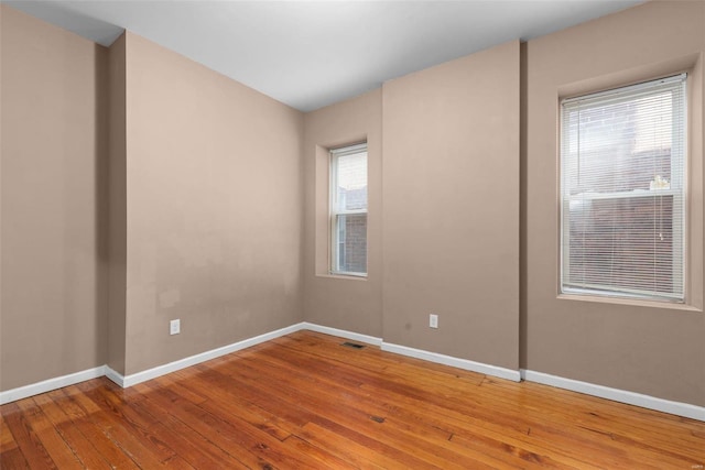 empty room with wood-type flooring