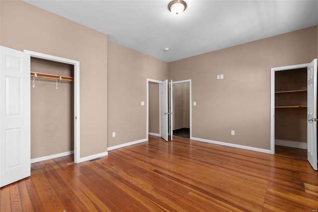 unfurnished bedroom featuring hardwood / wood-style floors