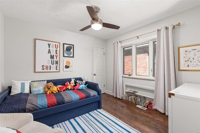 bedroom featuring wood finished floors and a ceiling fan