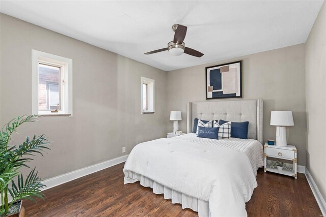 bedroom with baseboards, wood finished floors, and a ceiling fan