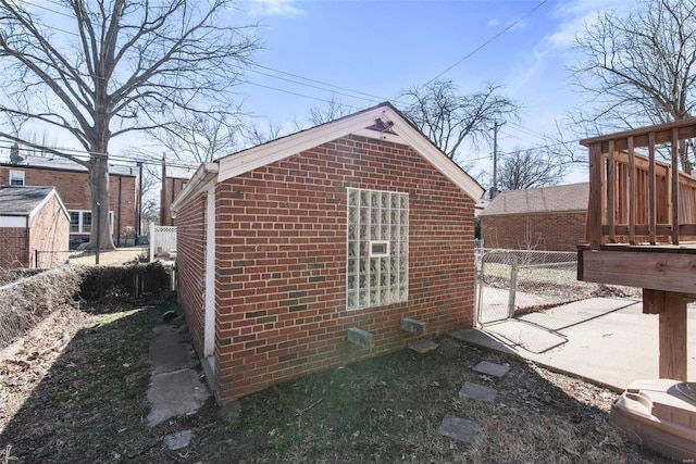 view of outbuilding with a gate and fence