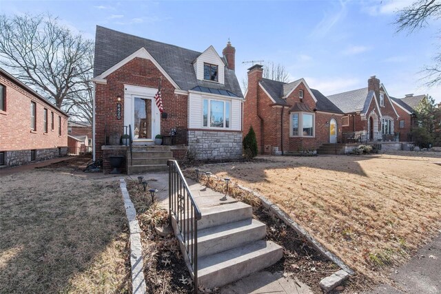 view of front of property featuring brick siding and stone siding