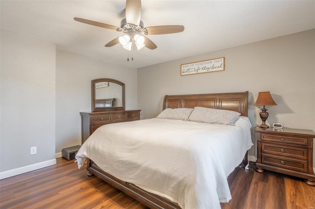 bedroom with dark wood-type flooring and ceiling fan