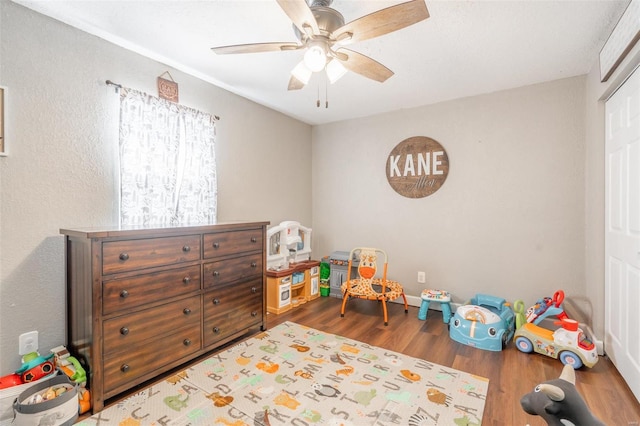 game room with ceiling fan and hardwood / wood-style floors