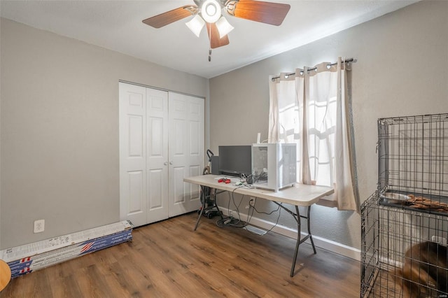 home office featuring ceiling fan and wood-type flooring