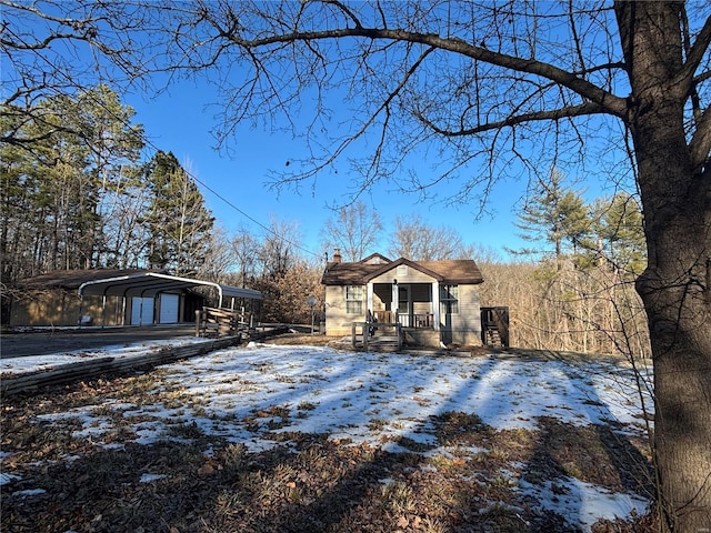 view of front of property with a carport