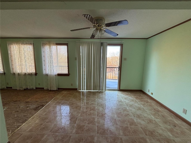 empty room featuring crown molding, ceiling fan, and a textured ceiling