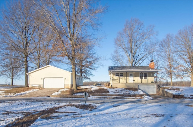 view of front of house featuring covered porch and a garage