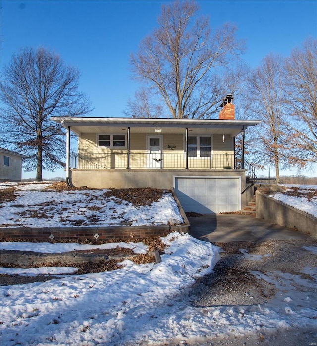 view of front of home with a porch and a garage