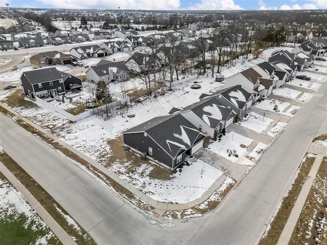 snowy aerial view featuring a residential view