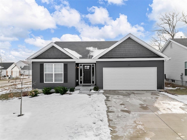 view of front of property with driveway and an attached garage