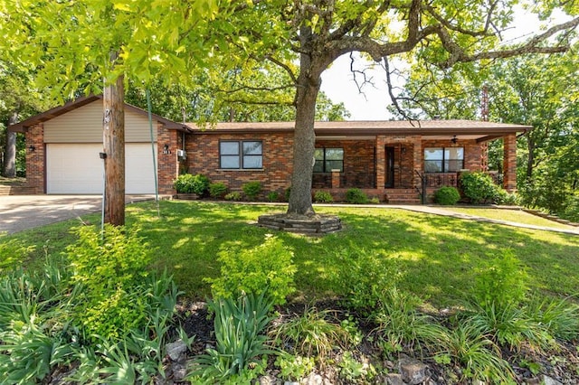 ranch-style house featuring a garage and a front yard