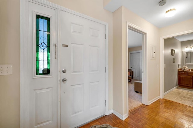 entryway with light parquet flooring