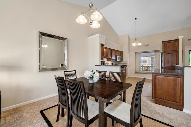 dining room featuring high vaulted ceiling, light carpet, and a notable chandelier