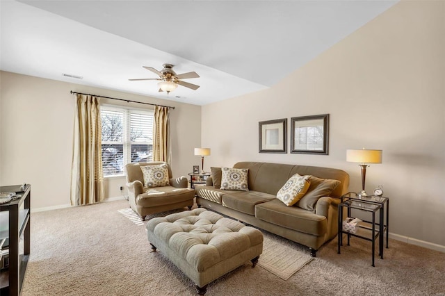 carpeted living room with ceiling fan