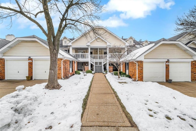 view of front of property featuring a garage and a porch