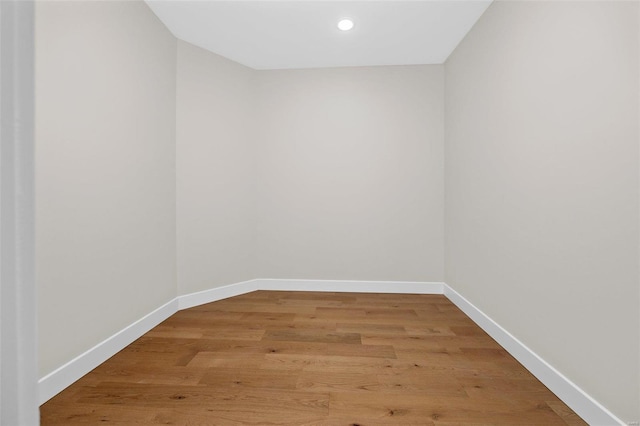 spare room with hardwood / wood-style floors