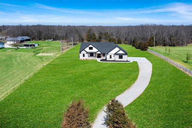 drone / aerial view with a rural view and a forest view