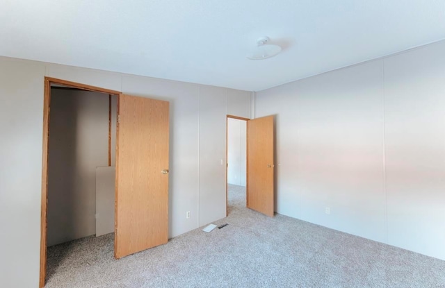 unfurnished bedroom featuring carpet floors