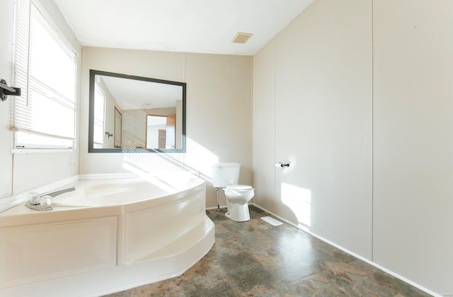 bathroom featuring toilet and a bathing tub