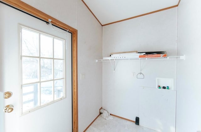 laundry room with washer hookup, crown molding, and a healthy amount of sunlight