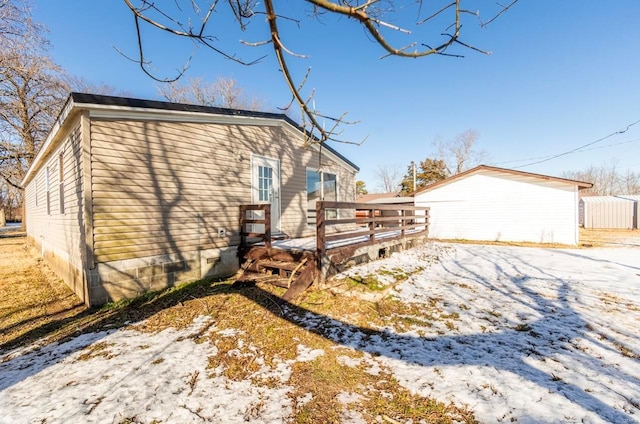 view of snow covered house